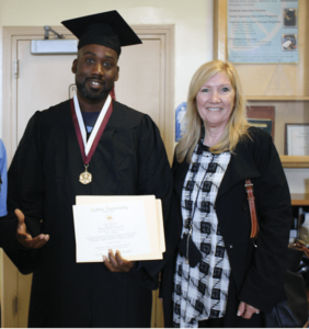 Graduate George "Mesro" Coles-El celebrating with SQ GED instructor D. Searle