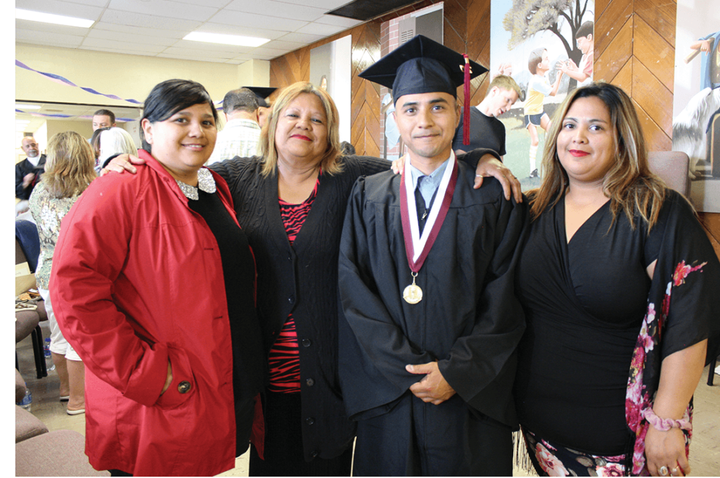 Sister Sophia, mom Sandra, graduate Eddie Herena, and sister Monica