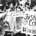 Protesters hold a vigil outside of state prison CIW