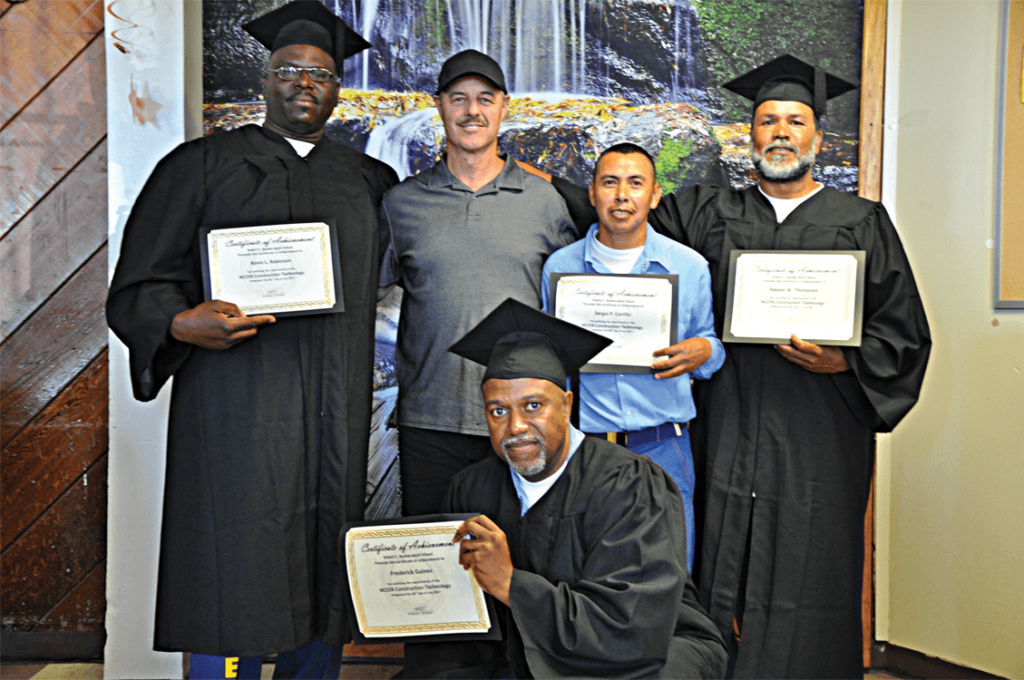 Vocational instructor Dante Callegari with his graduates Kevin Robinson, Sergio Carrillo, Donald Thompson and Fredrick Gaines