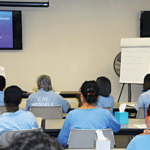 Dr. Covington teaches new peer facilitators at CIW