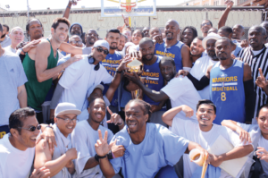 Bob Myers (in green) with the winning SQ Warriors and spectators