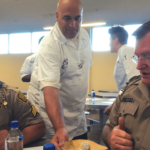 Steve Piazza serving meals to correctional officers