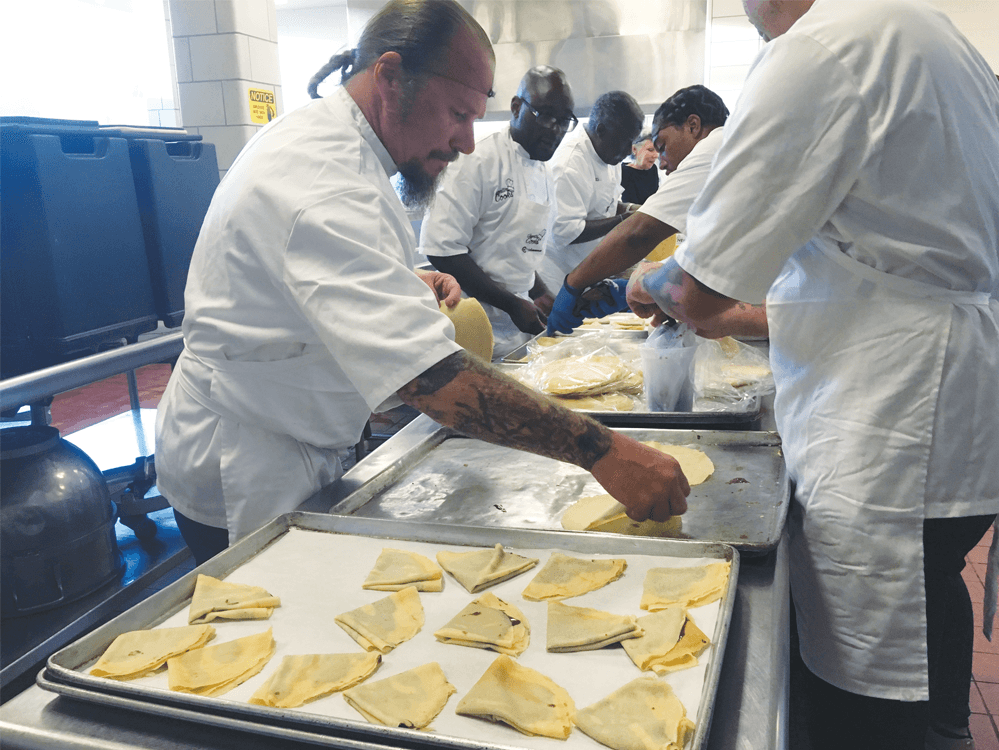 Inmates preparing raspberry Nutella crepes