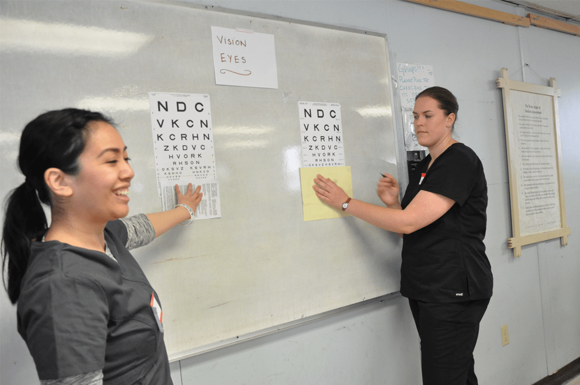 Nurses demonstrating eye exams