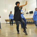 Participants learn to practice Tai Chi in the Lower Yard Gym