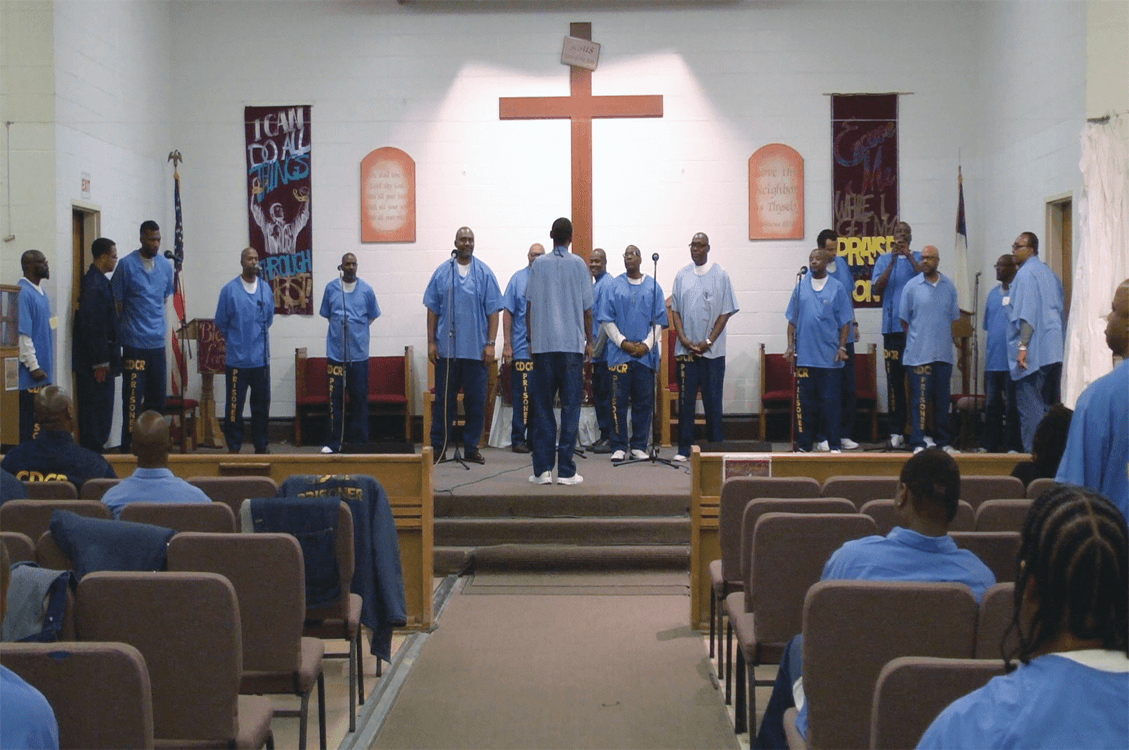Choir preparing to sing “Bless Your Holy Name”