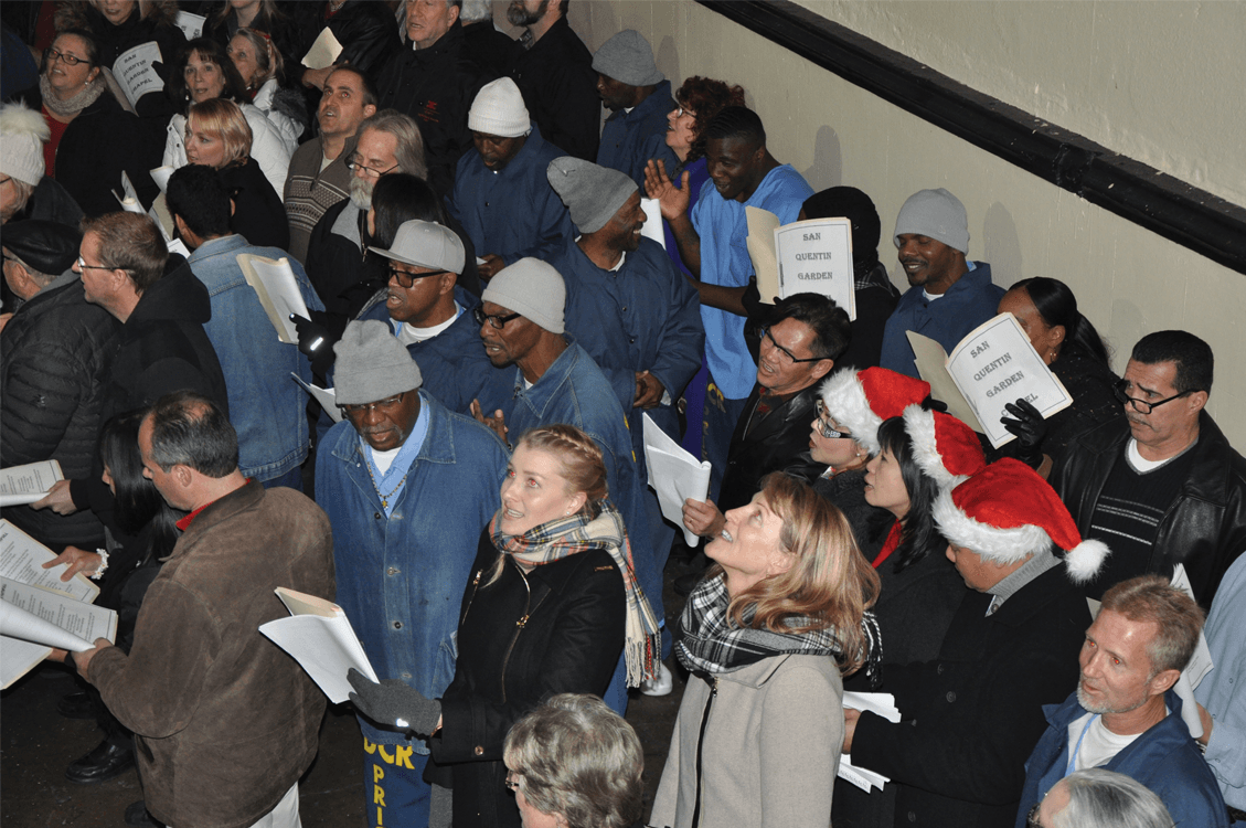 Inmates and volunteers singing in West Block