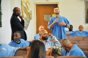Van Jones listening to Branden Terrell ask a question of the panel