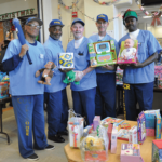 Veterans displaying the various toys for the children