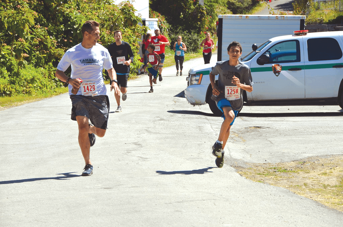 Chris Schuhmacher passing another runner at the Mt. Tamalpais in the Dipsea Race