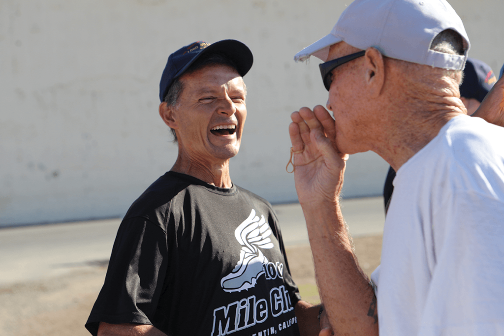 1000 mile Coach Kevin Rumon joking with runner Michael Keeyes