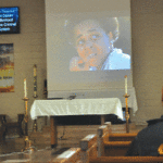 Prisoner watching the documentary premiere at the chapel