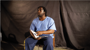 Darius Sommons performing from his book