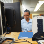 Female coder at work in CALPIA’s coding program