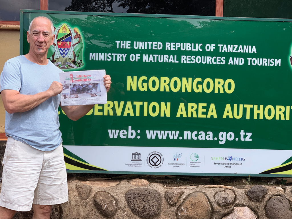 SQN Donor Jeff Marcous of White Salmon, Washington in Tanzania with the paper