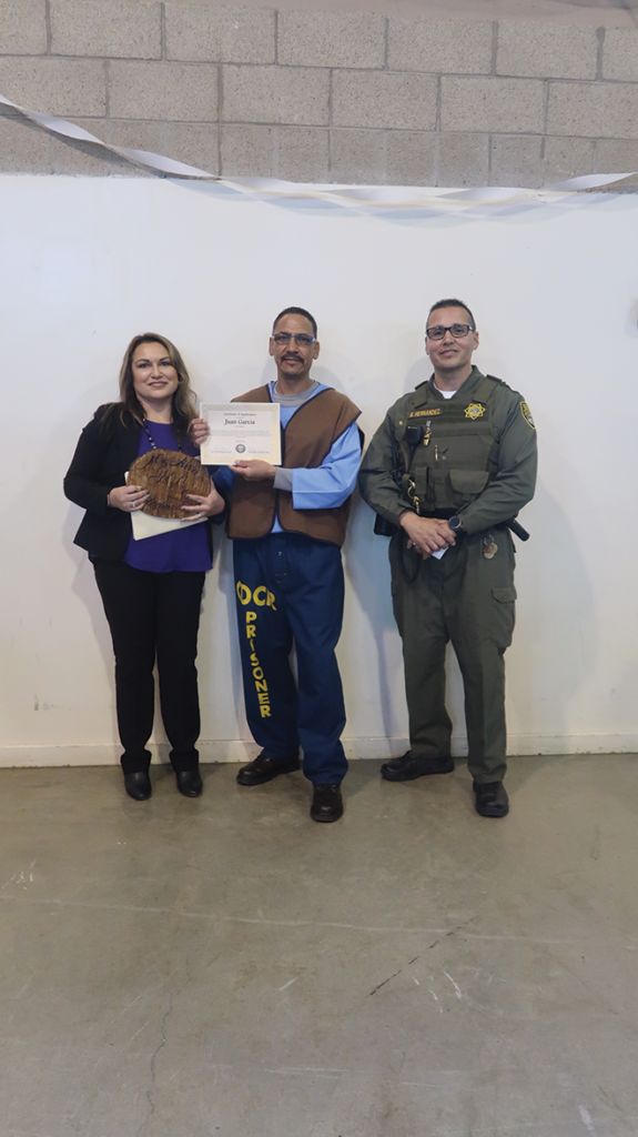 E. Alva, Juan Garcia and YOP Resource Officer B. Hernandez