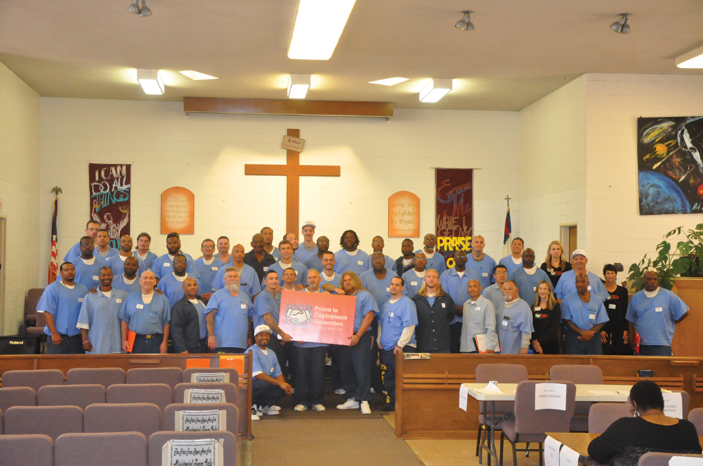Prison to Employment Connection graduates and volunteers