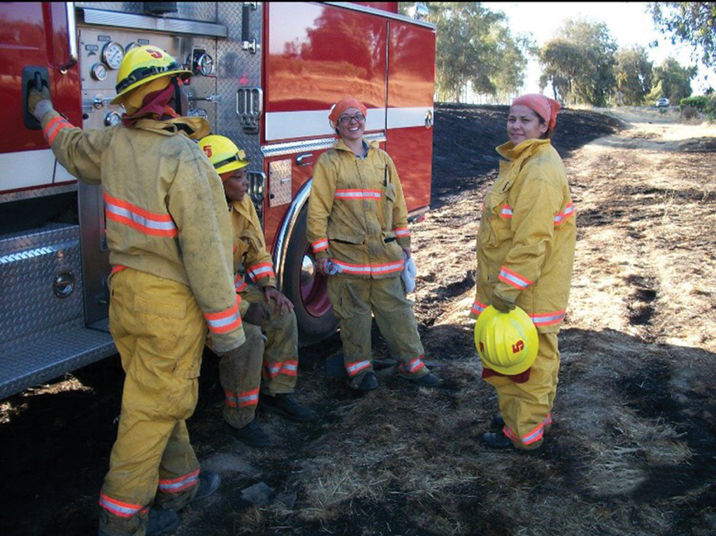Amita Mota (center) with her fellow firefighters