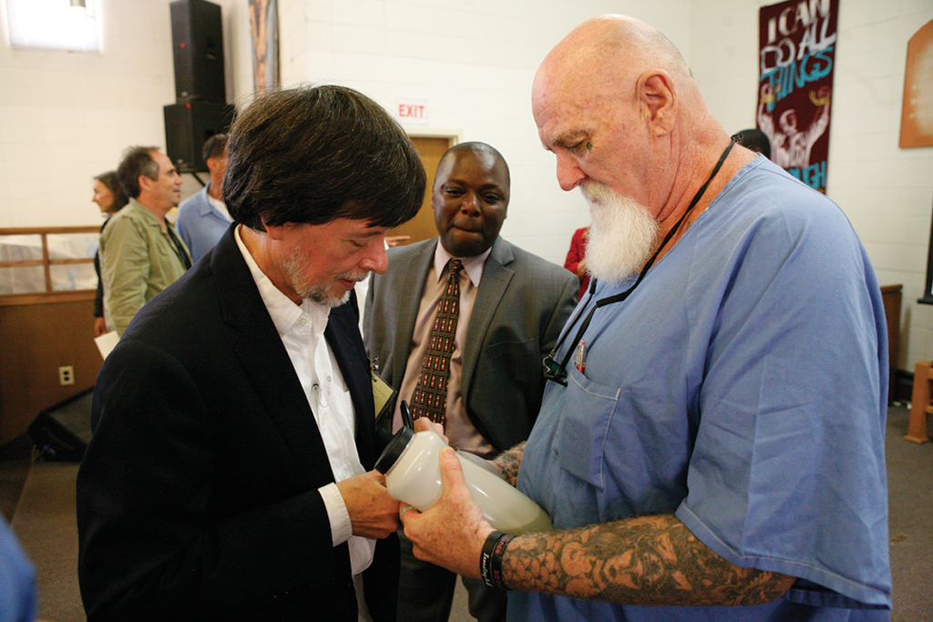 Burns signing autographs after the event