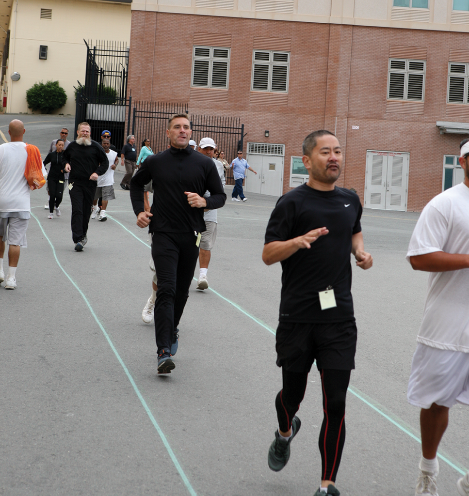 Phillip Peng with the Skid Row runners on the Lower Yard