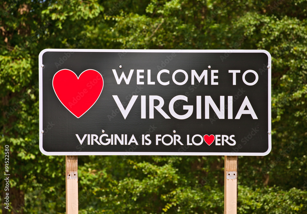 Virginia is for Lovers, state moto and welcome sign on a billboard sorrounded by trees