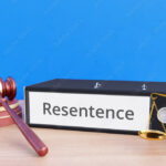 Resentence – Folder with labeling, gavel and libra – law, judgement, lawyer