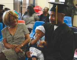 Wilhelmina Johnson with son Graduate Claudius Johnson holding his great nephew Wilhelmina Johnson with son Graduate Claudius Johnson holding his great nephew