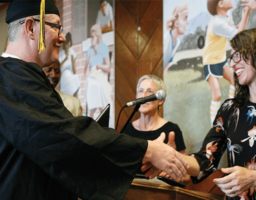 Craig Johnson receiving an Associates of Arts degree from PUP Academic Director Amy Jamgochian, Ph.D Craig Johnson receiving an Associates of Arts degree from PUP Academic Director Amy Jamgochian, Ph.D