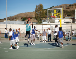 Green teams Dan Wohl shooting a jumper over SQ Warrior Allan Mcintosh with Jonte Washington Dan jumper