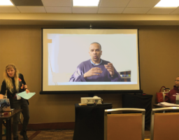 Amber Shields with James King (video screen) presenting their paper King 1