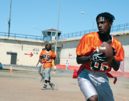 Quarterback Arron "A-1" Wooden seeks out his receiver before sending a
rocket-spiral downfield.