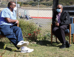 SQNews’ Sports Editor Timothy Hicks (left) interviews the Ella Baker Center’s State Campaign Manager, James King (center), who was previously incarcerated at San Quentin State Prison.