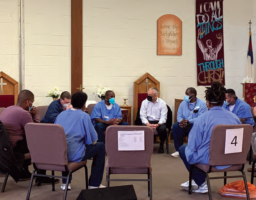 Prisoners at San Quentin State Prison meet with Deputy Chief David Lazar and other top brass from the San Francisco Police Department to discuss social justice as part of the prison’s law enforcement forum series.