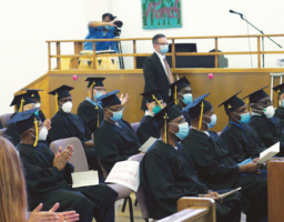 SQ Warden Ron Broomfield stands proudly alongside Mt. Tamalpais College’s graduating class of 2022. Graduates have faced innumerable hurdles for the past two years, including on-again/off-again programming due to Covid quarantines. Students persevered even during lockdowns, however, completing coursework while isolated in their cells, without the benefit of classroom instruction, and with limited access to instructors.
