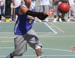 SQ Warrior Travis Vales shoots a pass to a
teammate.