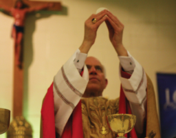 Archbishop
Salvatore Cordileone
consecrates the
Eucharist wafer
during the Mass.