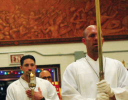Michael Callahan and Tony de Trinidad lead the entrance procession on Christmas Eve.