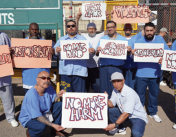 San Quentin prisoners display signs that reflect their messages for Victim Awareness.