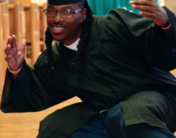 Philipe Kelly strikes a pose on
graduation day after receiving
his certificate from the Guiding
Rage Into Power program.