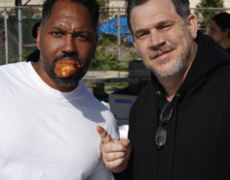 Marcus won't talk with his mouth full as he poses with Andrew Blaskovich, owner of Drewski's.